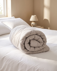 The Moonora duvet rolled on a made bed