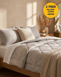 Moonora duvet in Moon Grey on a cosy bed, 2 free pillowcases worth £49.99